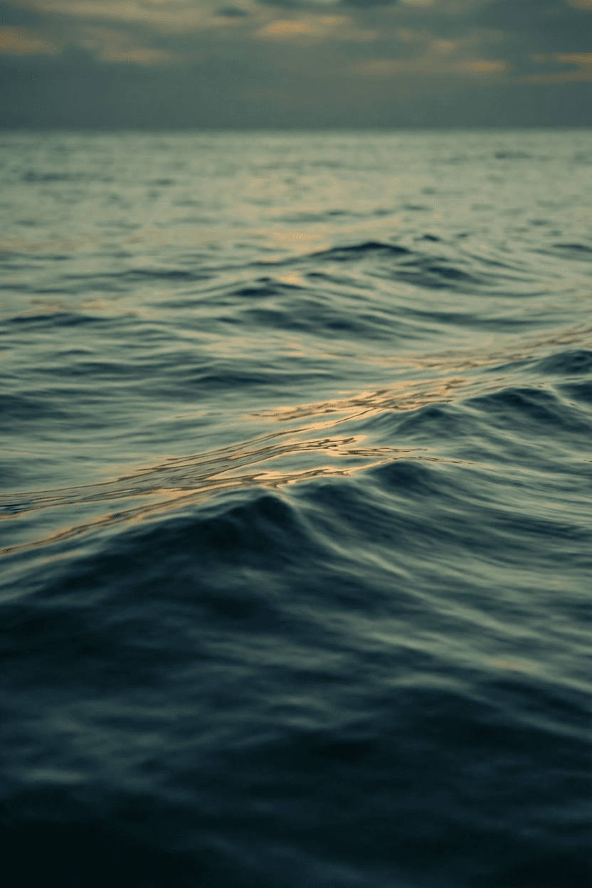 Ocean water at dusk with light across the surface representing strategic AI planning