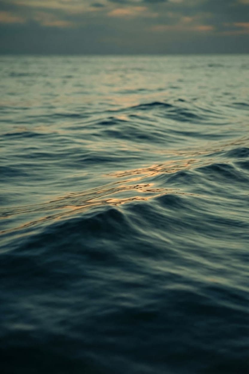 Ocean water at dusk with light across the surface representing strategic AI planning